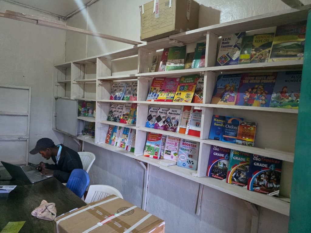 Newly delivered books wait to be sorted onto the library shelves.