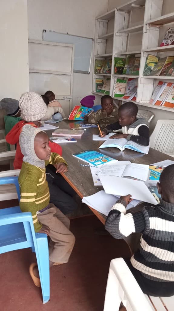Students reading and studying together at a PKN community library