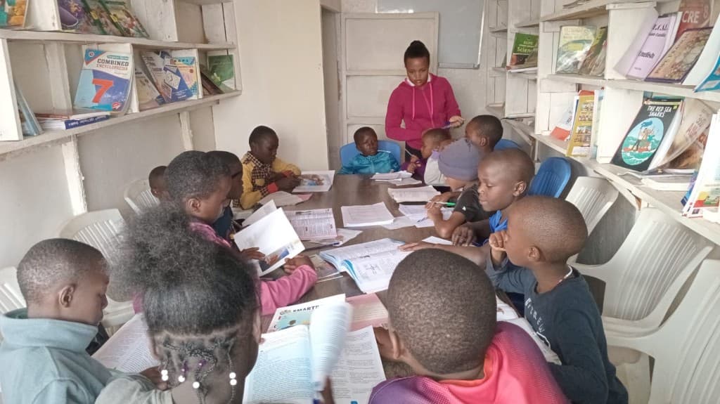 Students working through reading materials during a session.